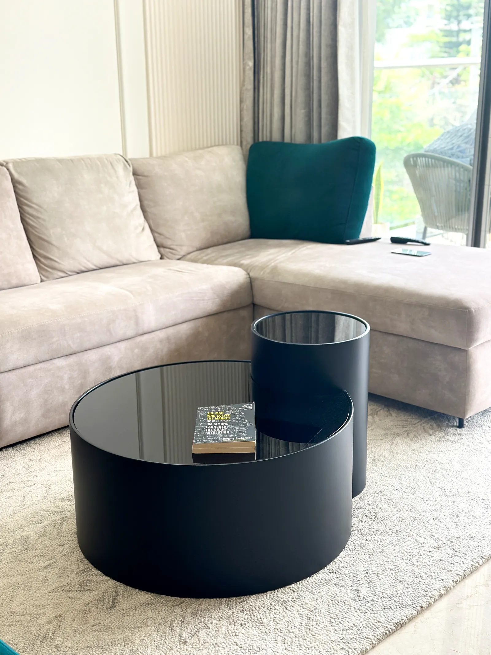 Grey sectional sofa with black nesting coffee tables — Somani's Residence